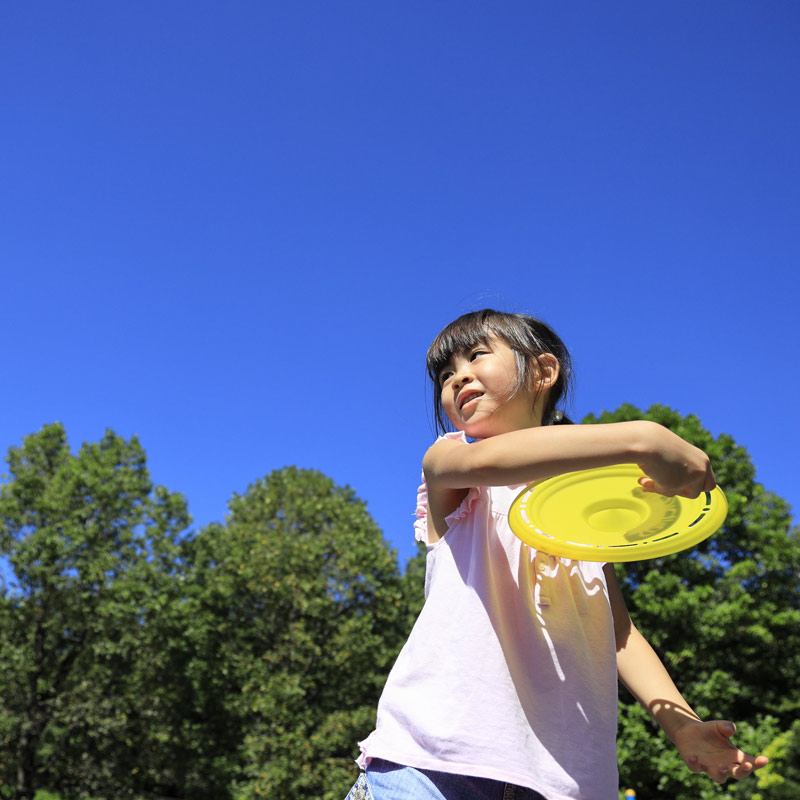 Young girl playing outdoors